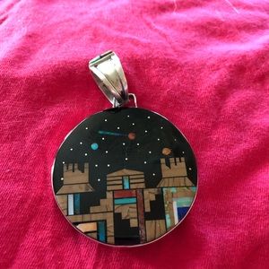 Sterling silver reversible Native American pendant.